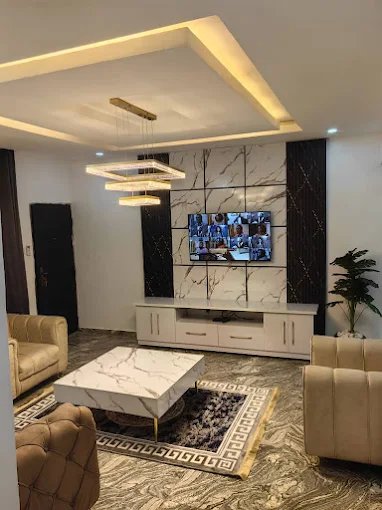 Living room with white table and TV