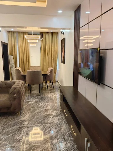Living room with brown settings and TV